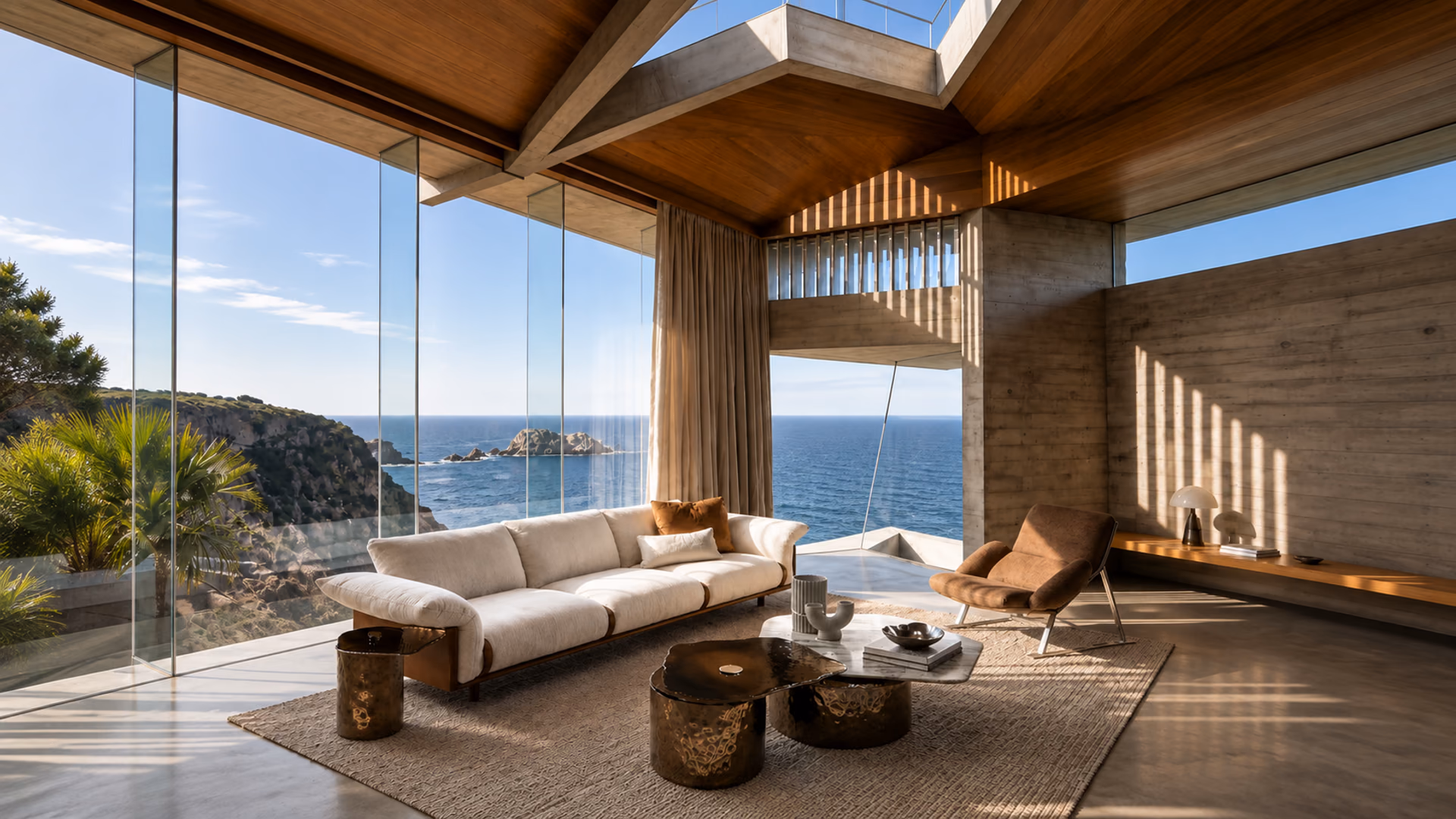 Arketipo cream sofa and brown lounge chair with sculptural tables in a glazed coastal living room.