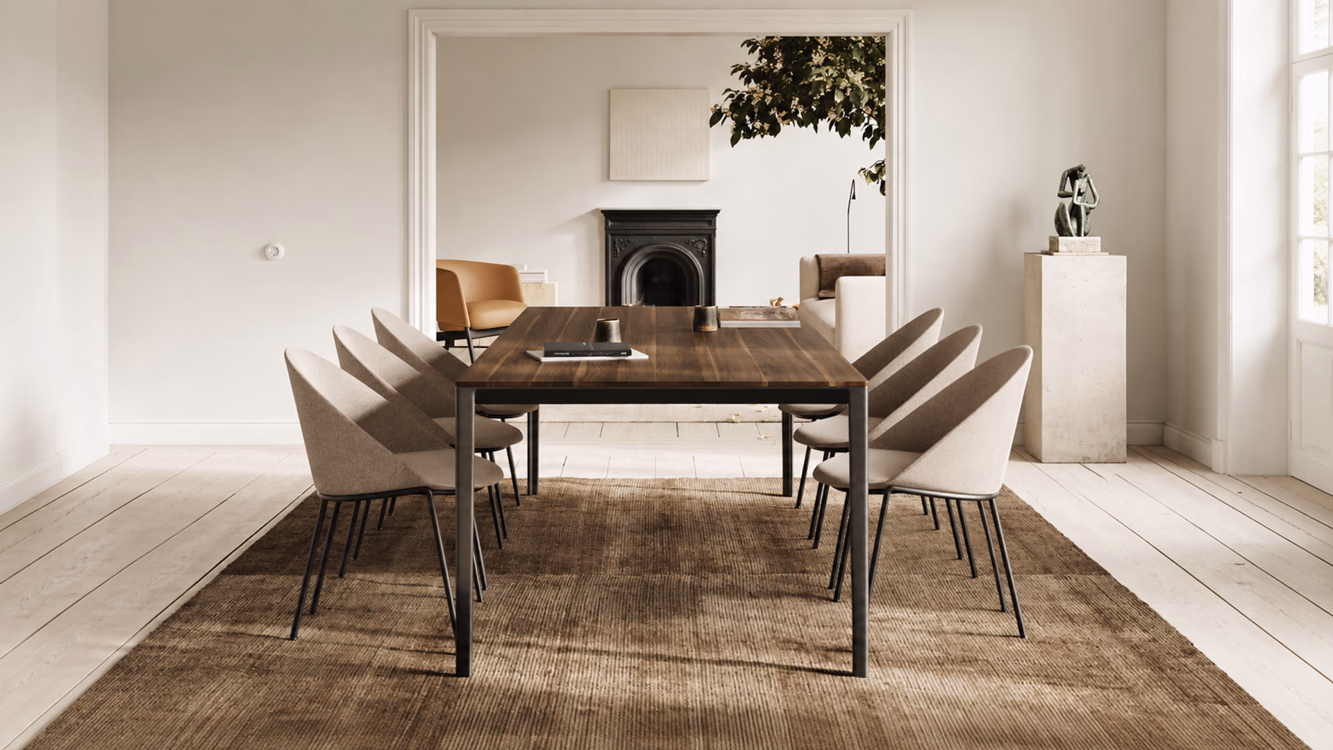 Bensen Circa upholstered dining chairs around an Able wood dining table in a light interior.