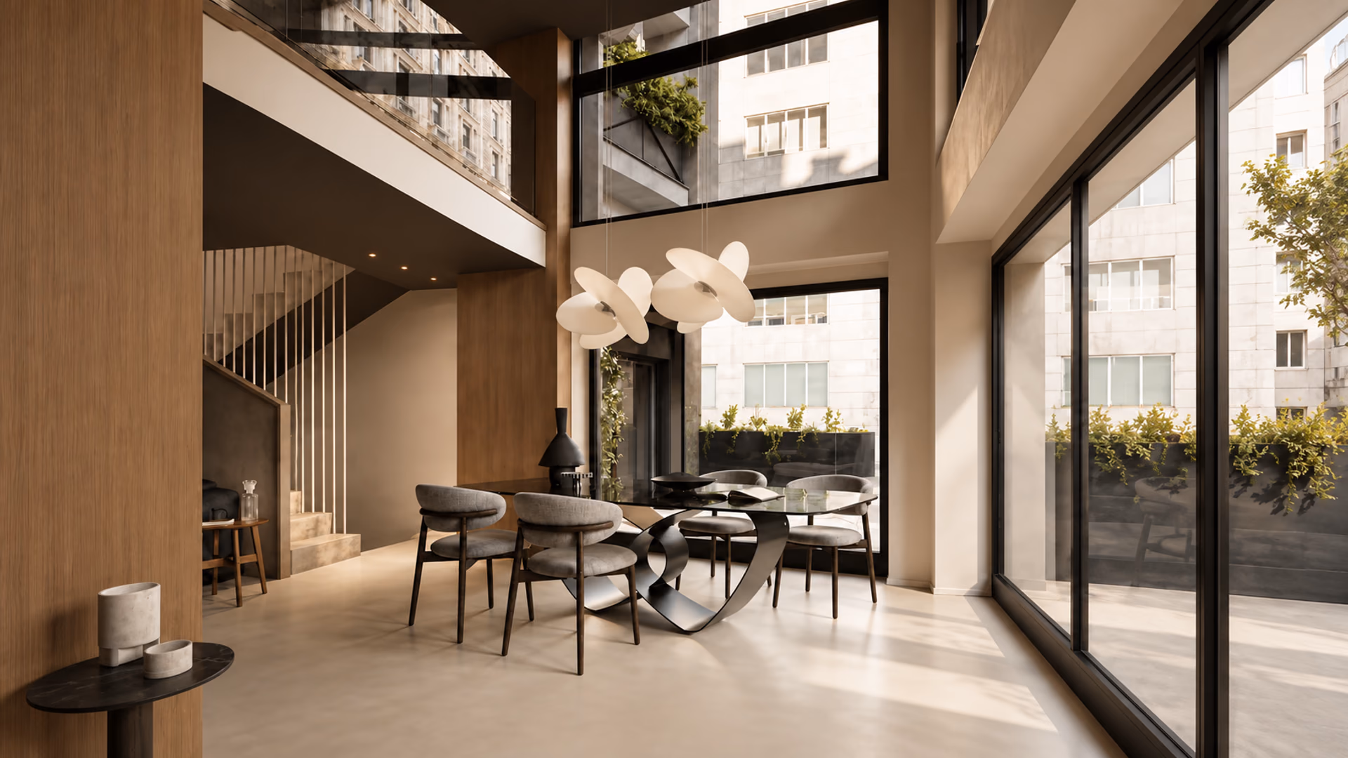 Calligaris glass dining table and upholstered chairs in a double-height room with tall windows.