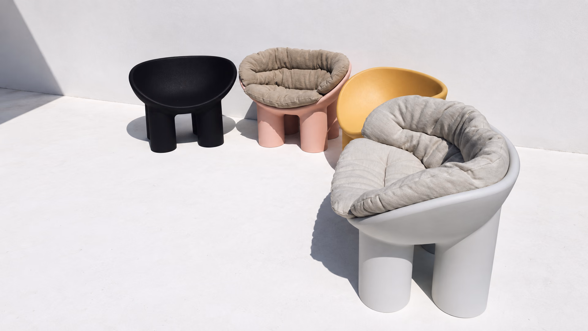Driade Roly Poly armchairs with rounded seats and cylindrical legs