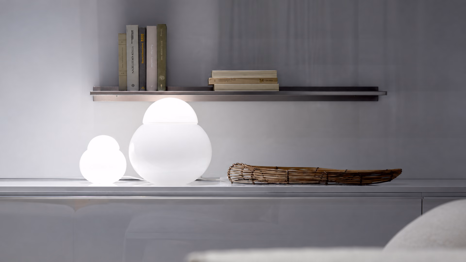 FontanaArte Daruma glass table lamps in two sizes on a shelf