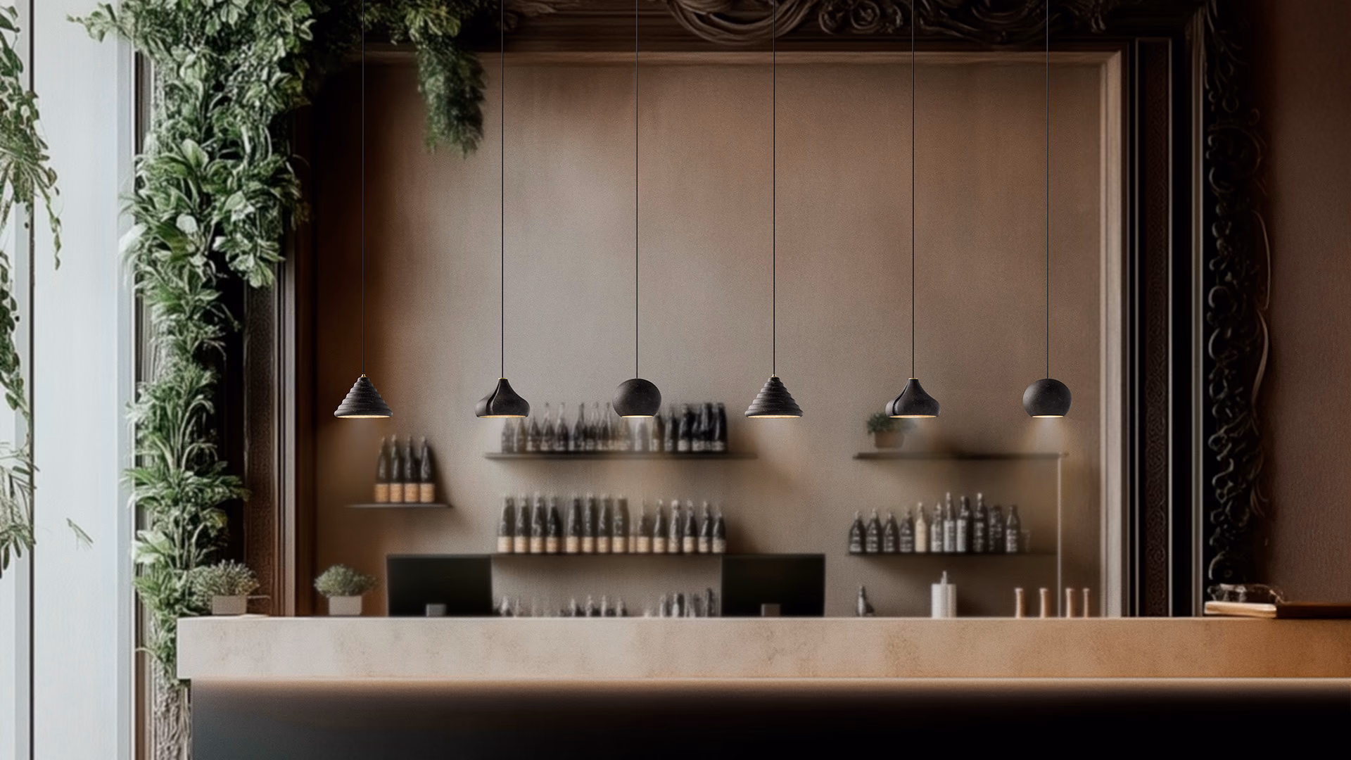 Foscarini small sculptural pendant lights in a row over a softly lit bar.