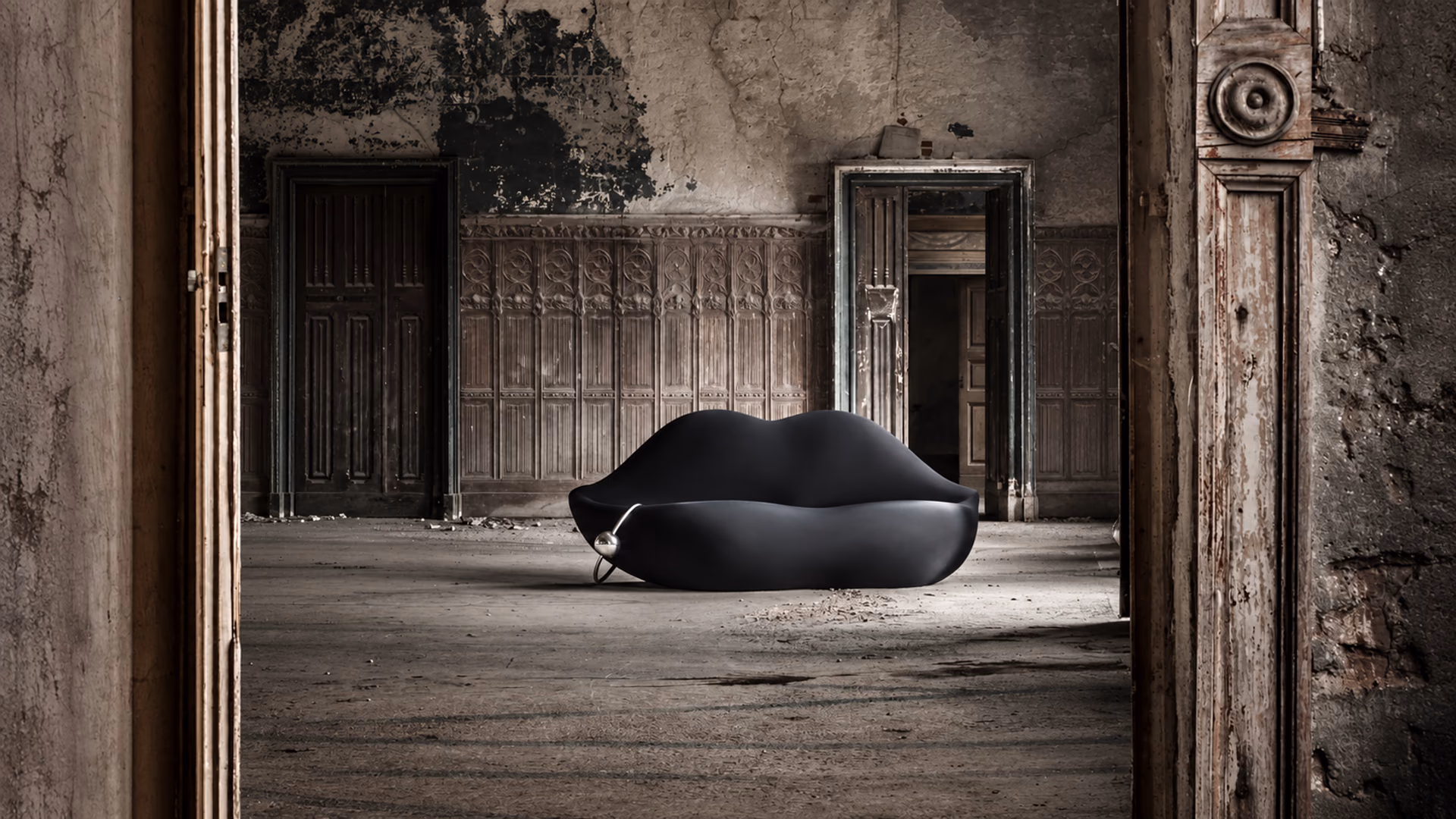Gufram Dark Lady black lip-shaped sofa in a historic interior