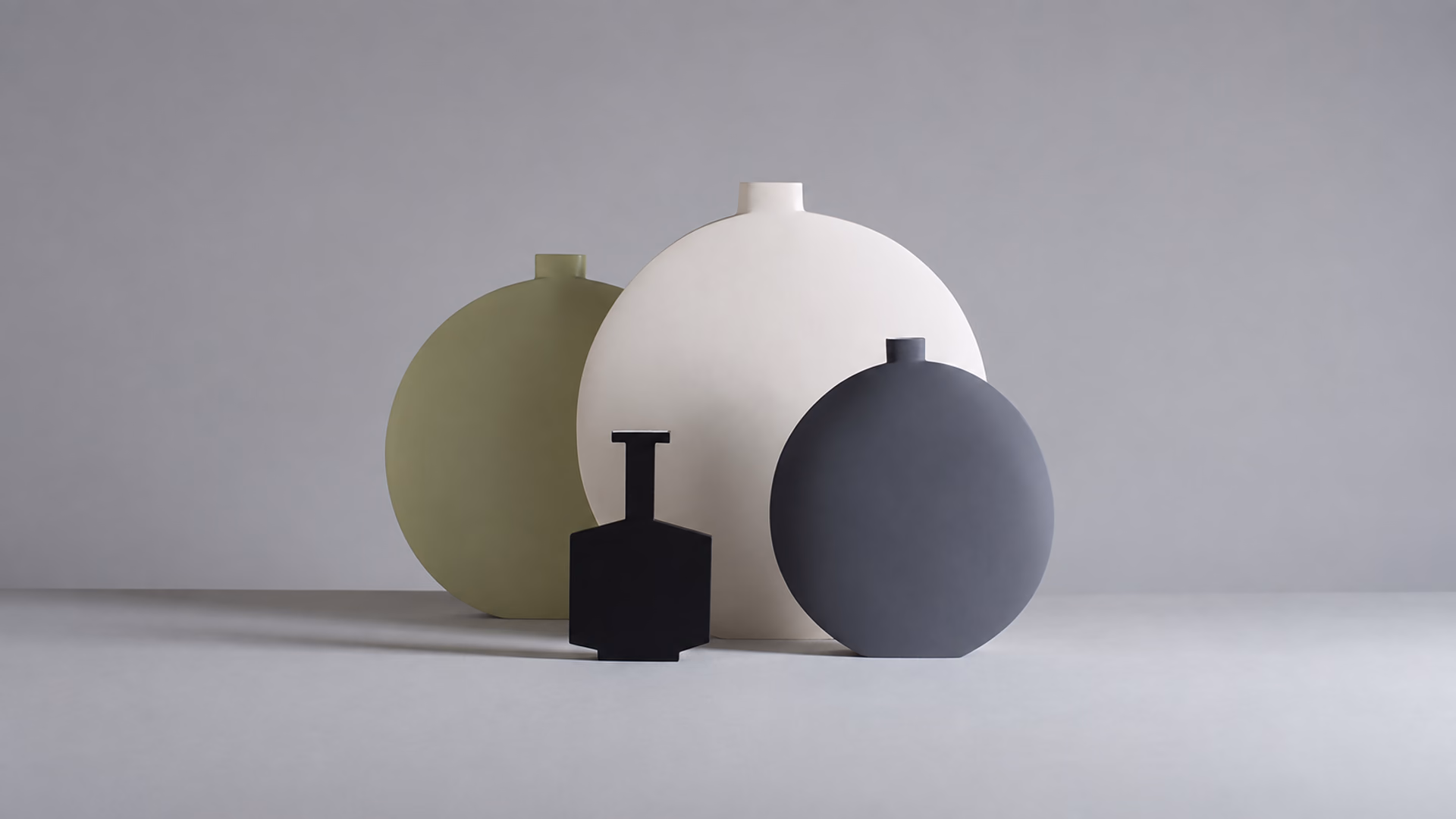 Kose Luna vessels with rounded silhouettes in white, olive and blue
