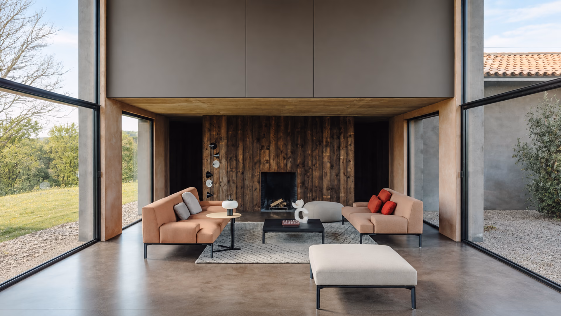 Lapalma upholstered seating and low tables in a double-height living room