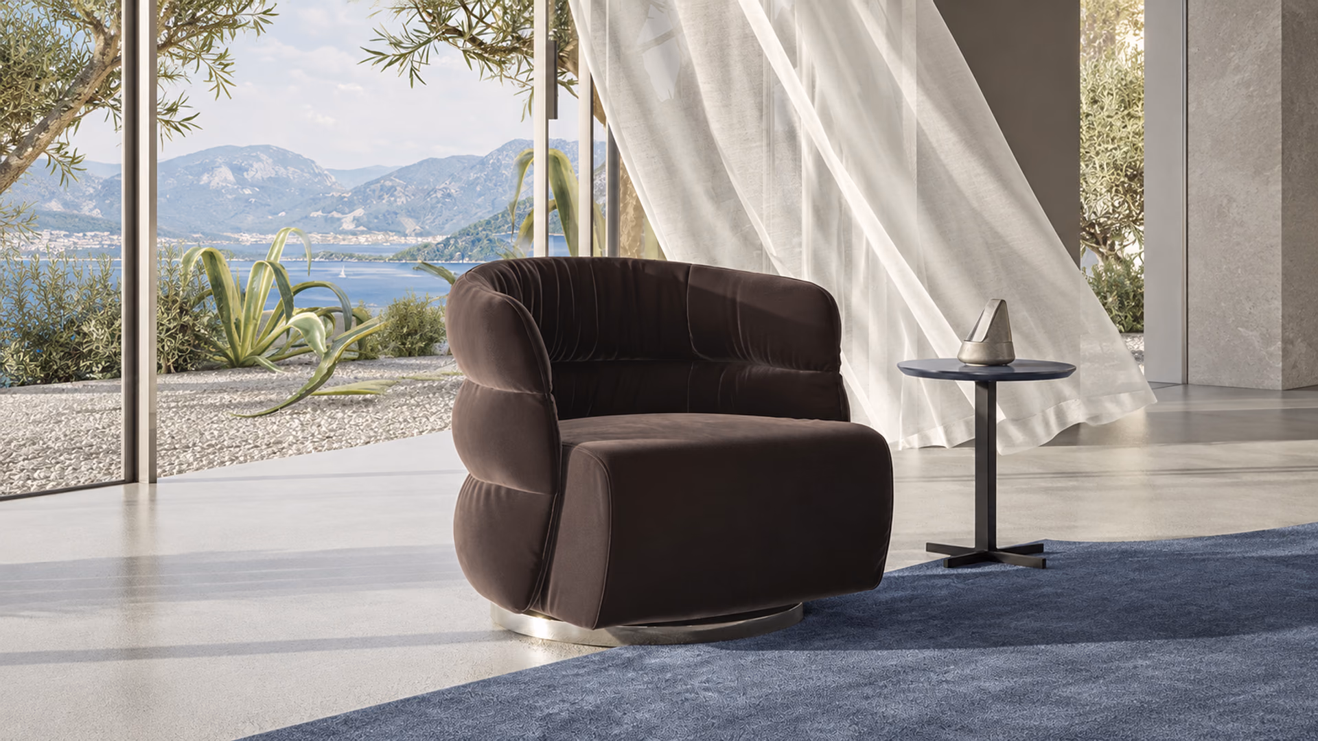 Natuzzi Italia brown upholstered armchair beside a window overlooking water and mountains
