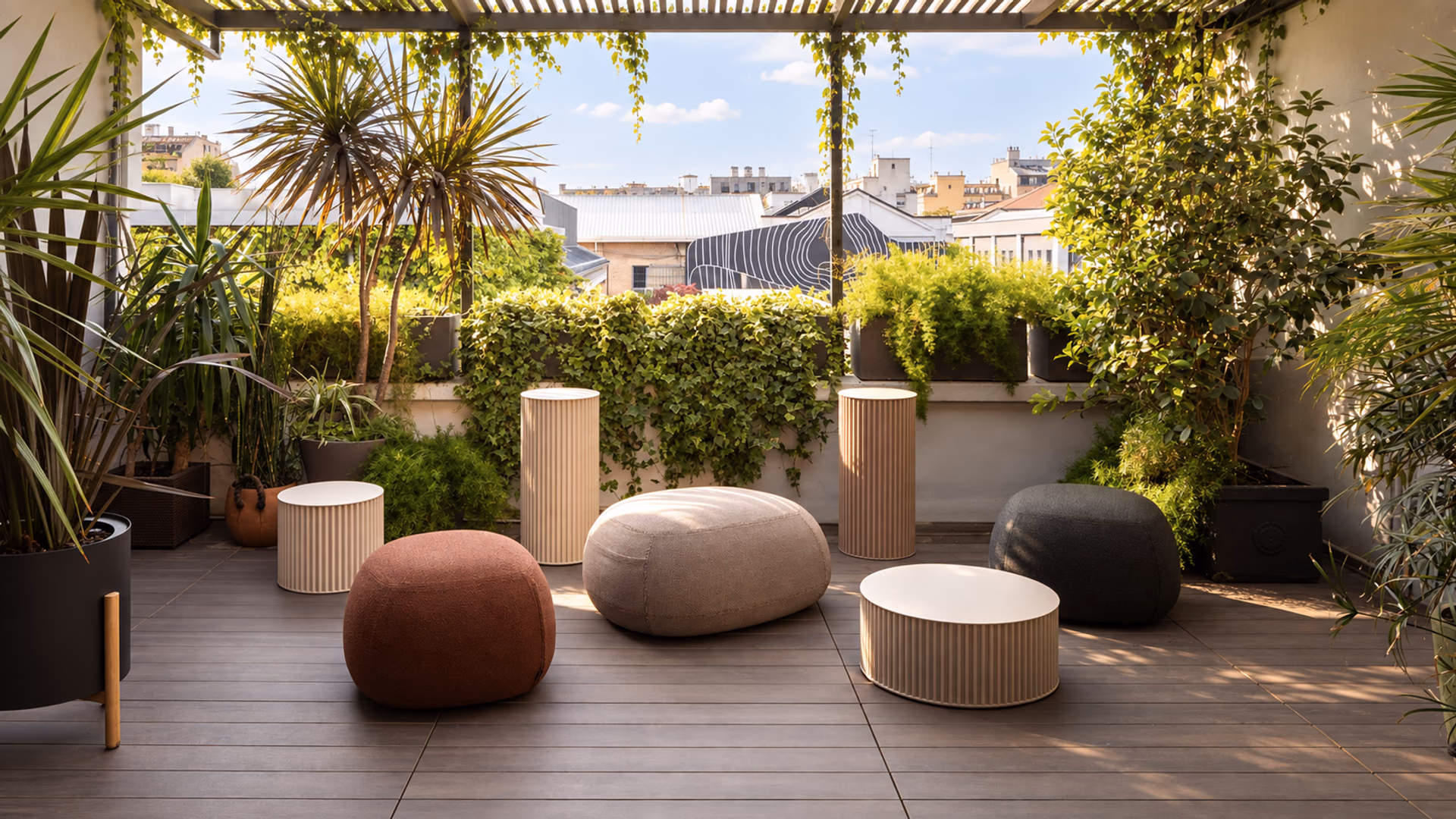 Opinion Ciatti rounded seating and ribbed tables on a lush urban terrace