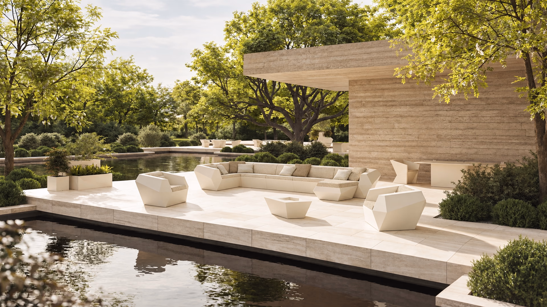 Vondom Faz angular outdoor sofa, lounge chairs and planters beside a reflecting pool