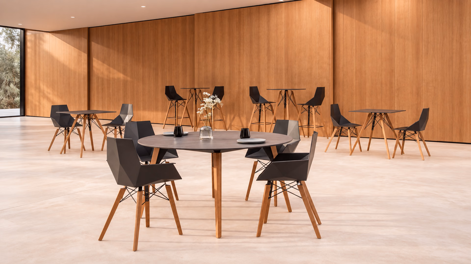Vondom Faz Wood chairs, stools and tables in a warm wood-paneled interior