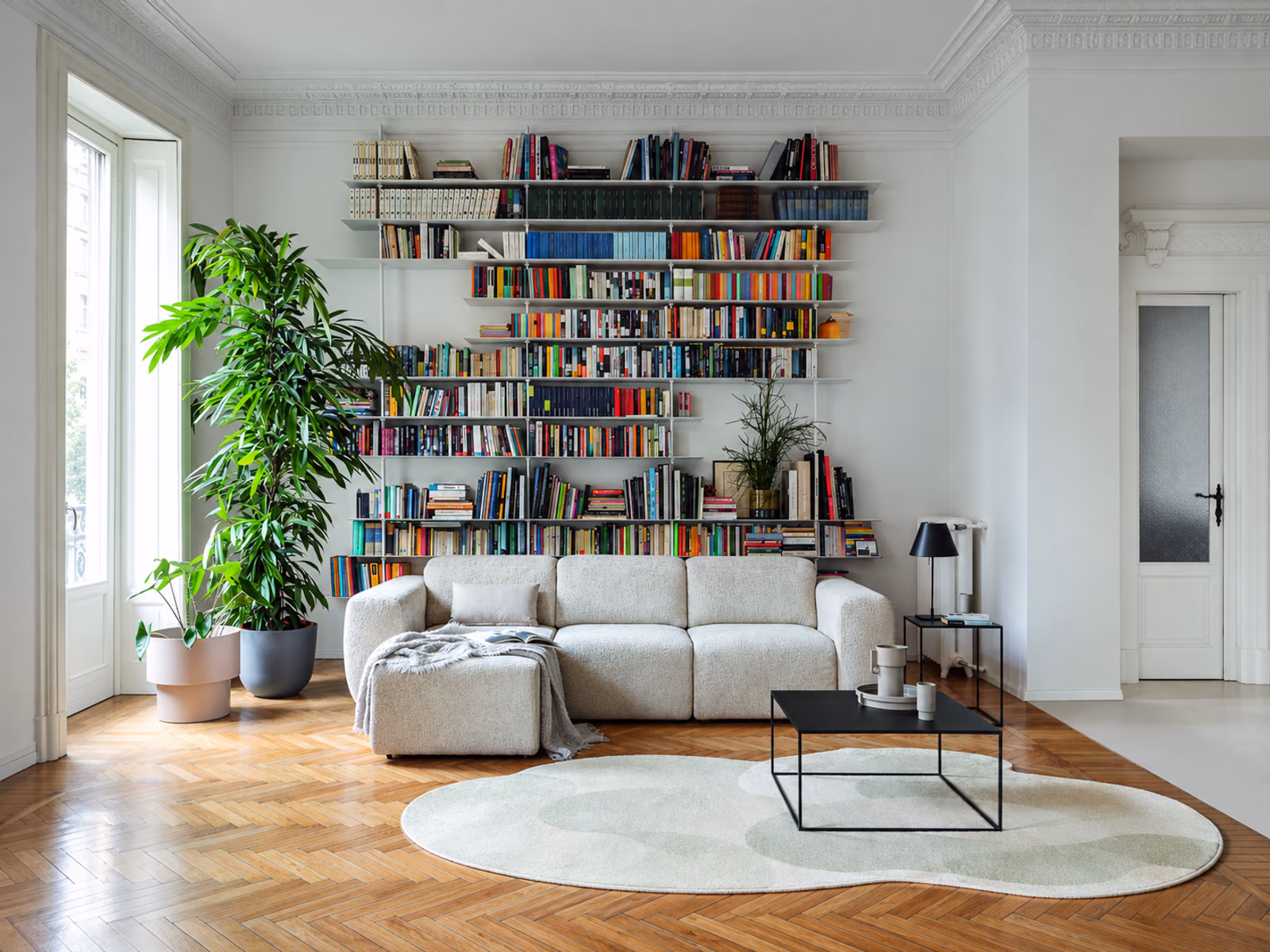 Calligaris: A Pandora sofa creates a relaxed seating area with cushions and coordinated living room furniture.