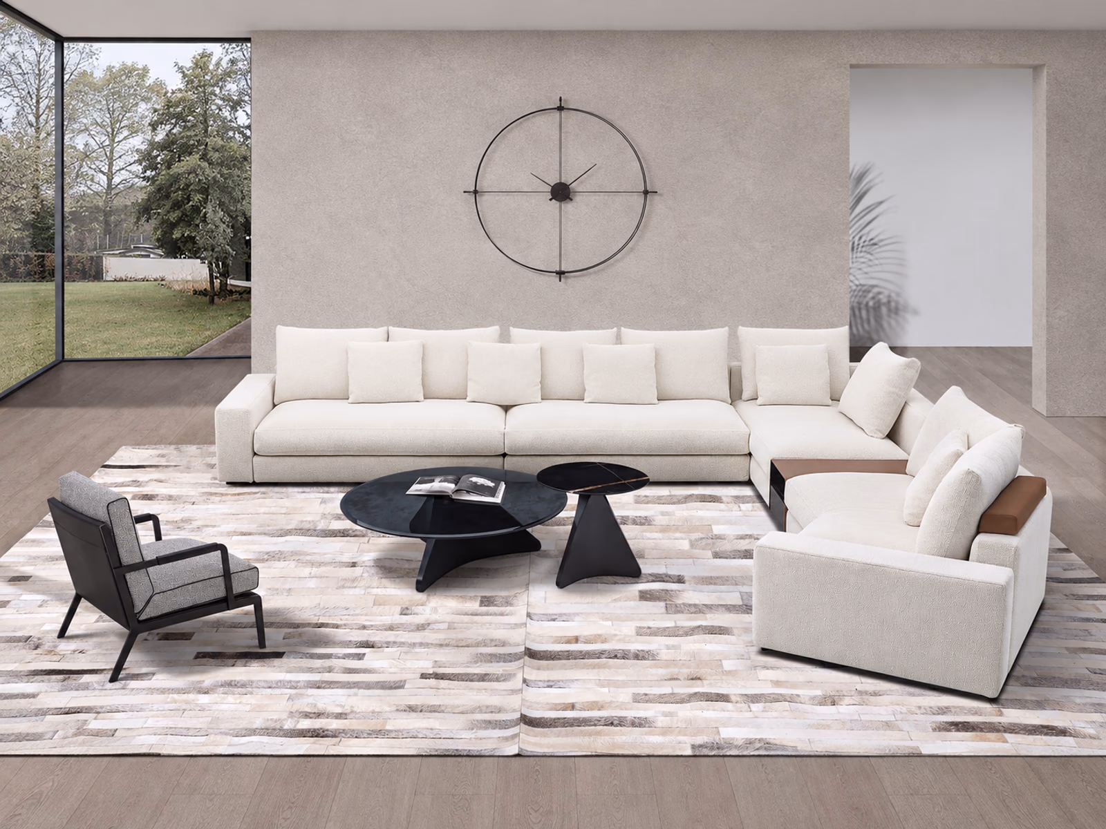 Camerich: A pale Epic sectional wraps around dark coffee tables in a bright room overlooking the garden.