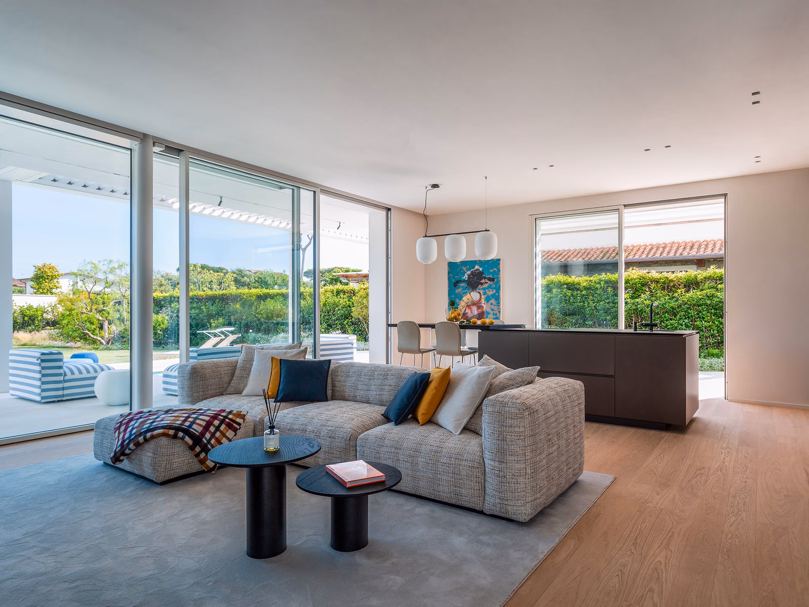 Cappellini: A white Oblong Plus seating composition uses repeated upholstered modules to define a generous living space.