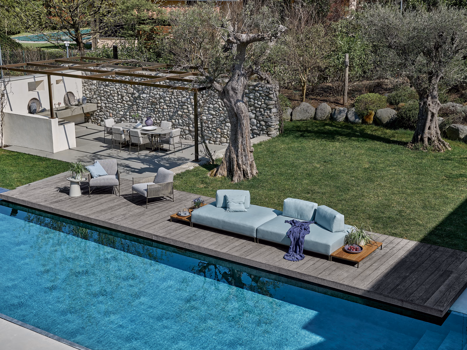 Ditre Italia: A Sanders Air sofa creates a lounge setting beside the pool.