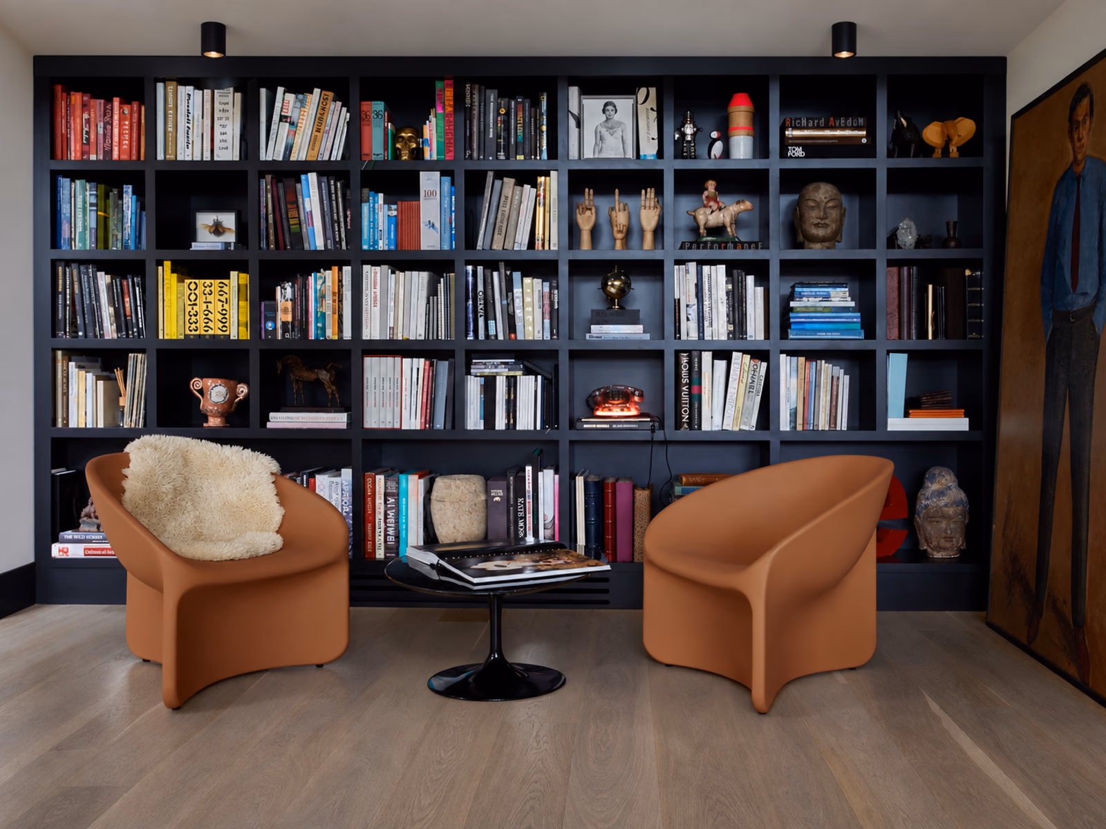 Heller: Two Bluff chairs create a warm seating area within a library.