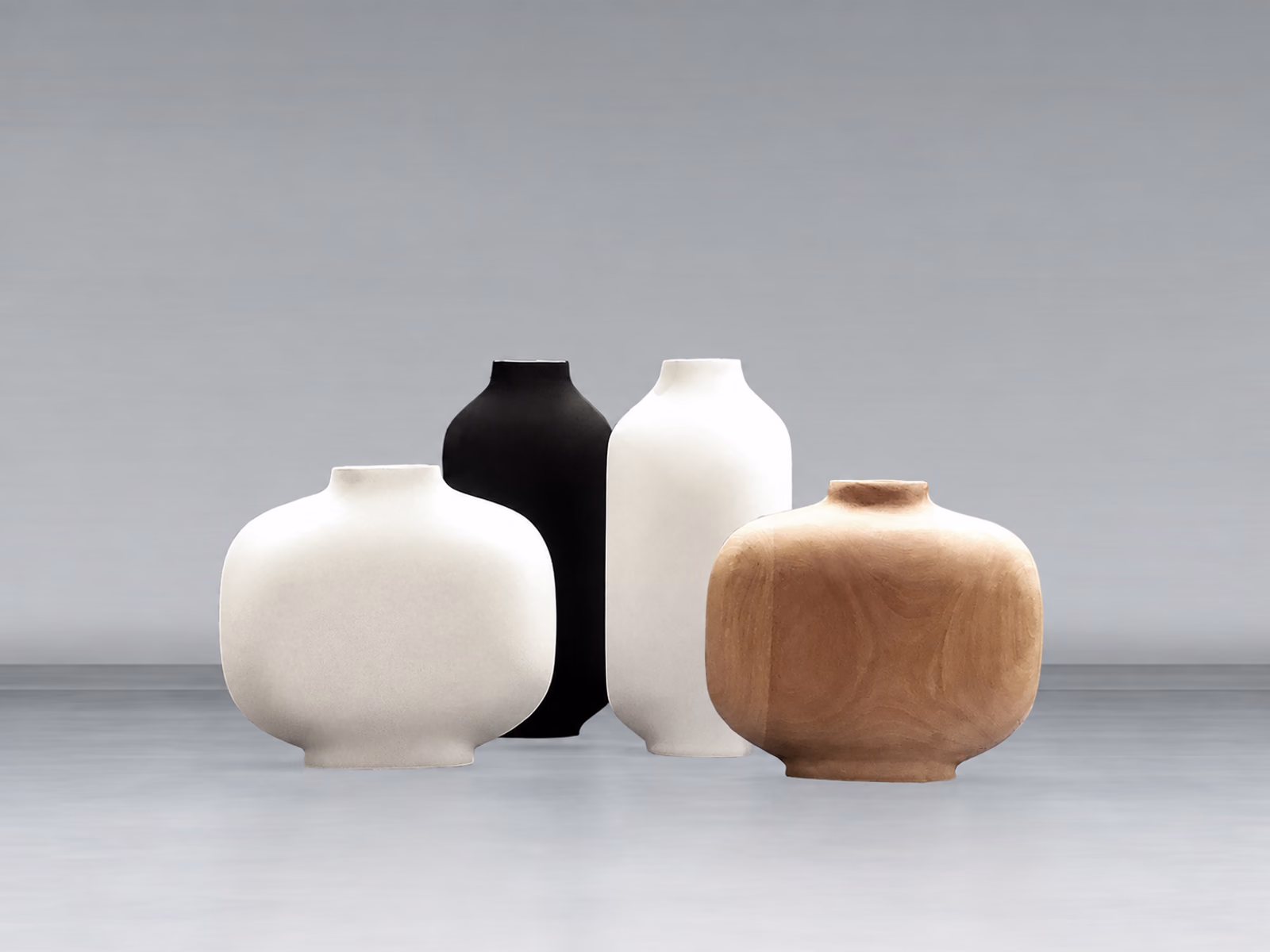 Kose: Palma vases in pale, dark and warm earthy finishes form a sculptural still life.