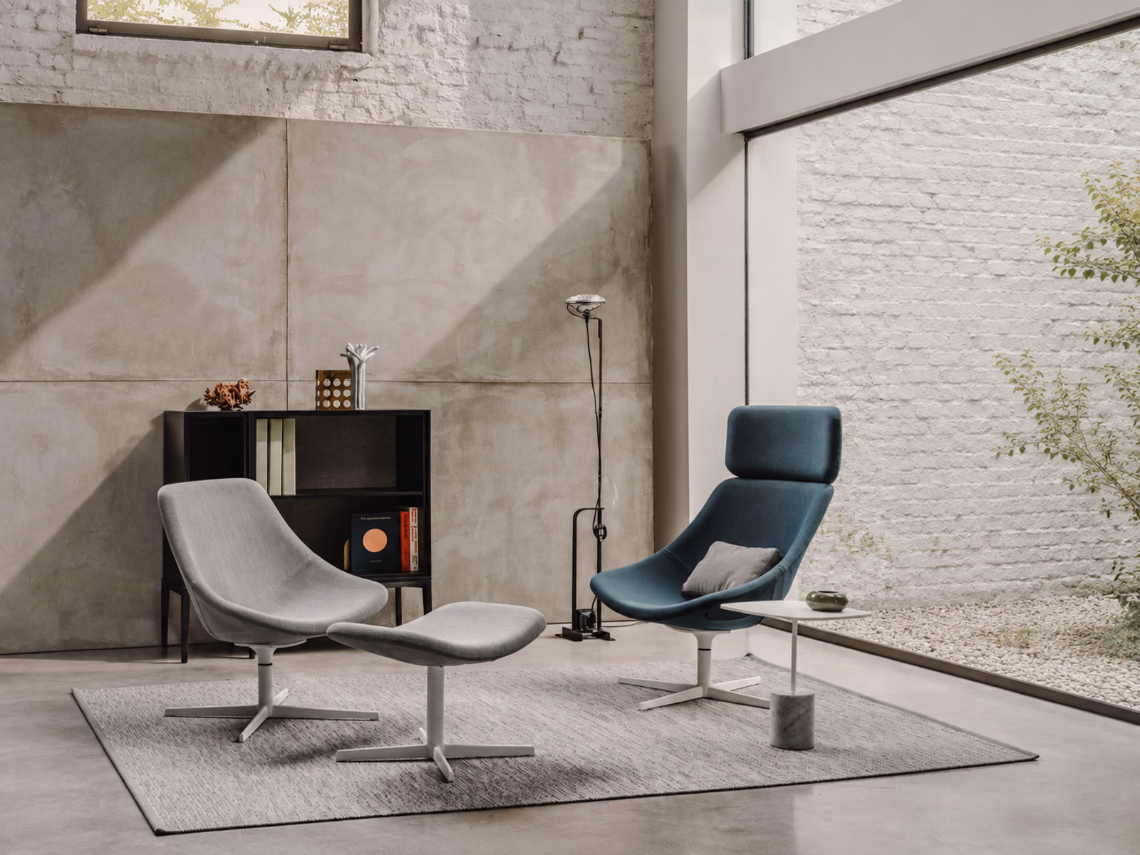 LaPalma: Blue and gray lounge chairs with a coordinating footrest create a quiet seating area.