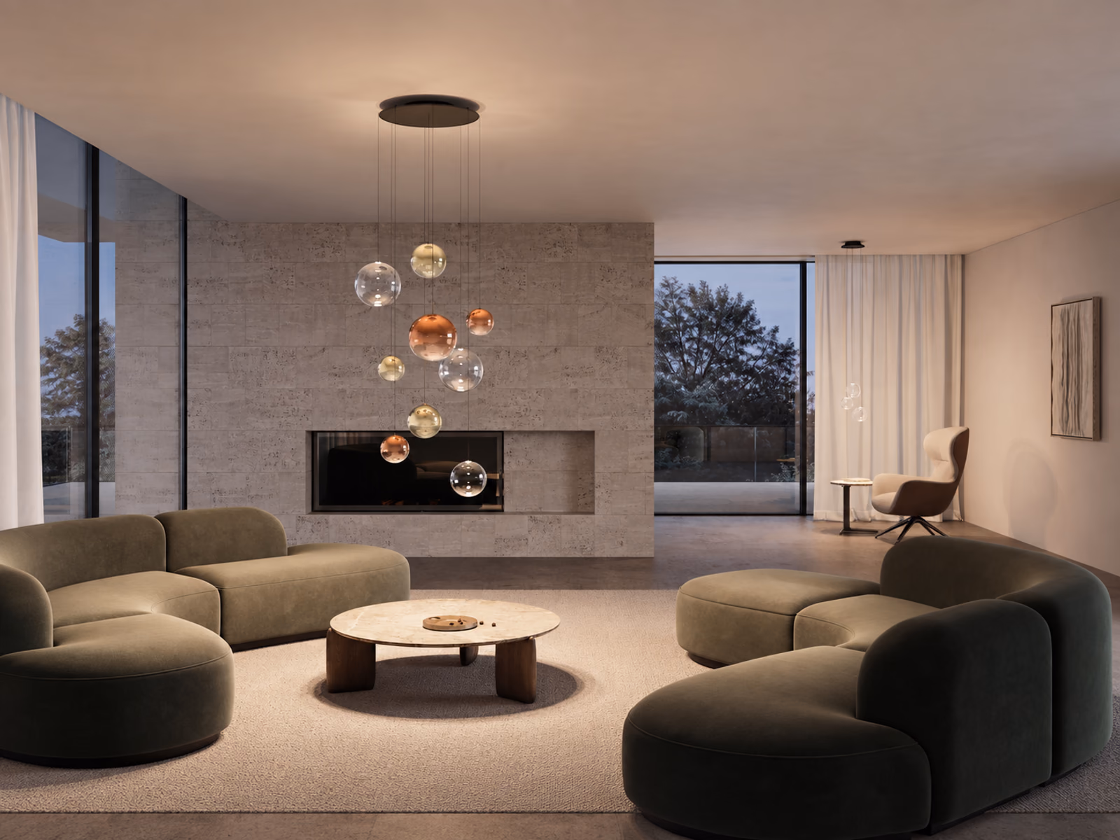 Lodes: Random Solo glass pendants hang above green curved sofas beside a stone fireplace.