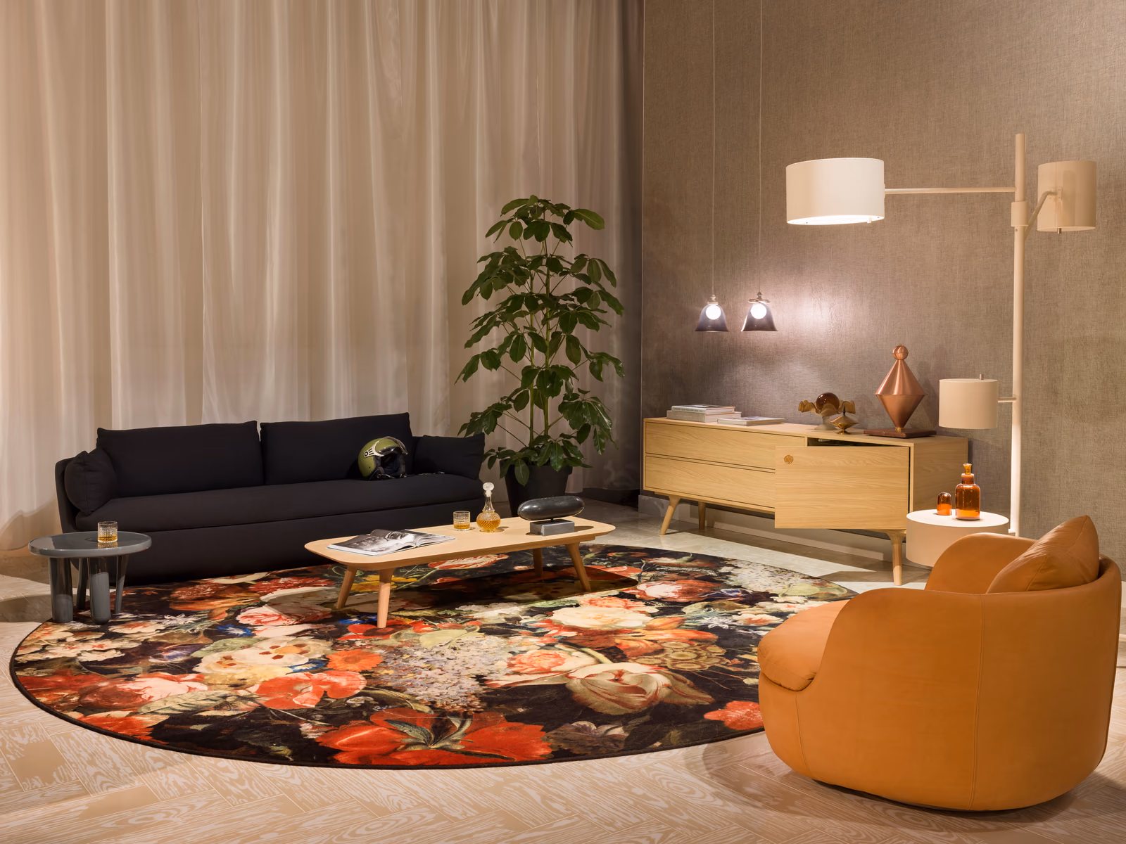 Moooi: A Bart sofa anchors a richly colored Moooi interior with dark and orange accents.