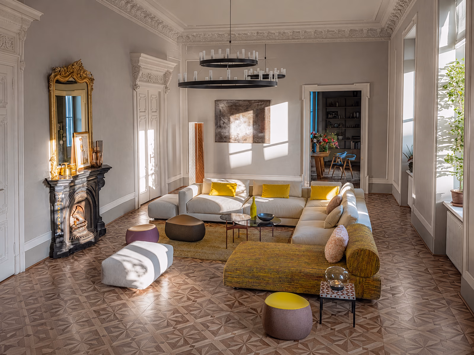 Moroso: A pale Salon Nanà sectional with yellow accents furnishes a room with ornate moldings and a fireplace.