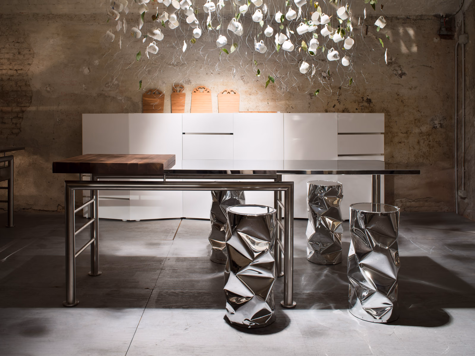 Opinion Ciatti: TAB.U pieces add reflective accents to a contemporary dining space.
