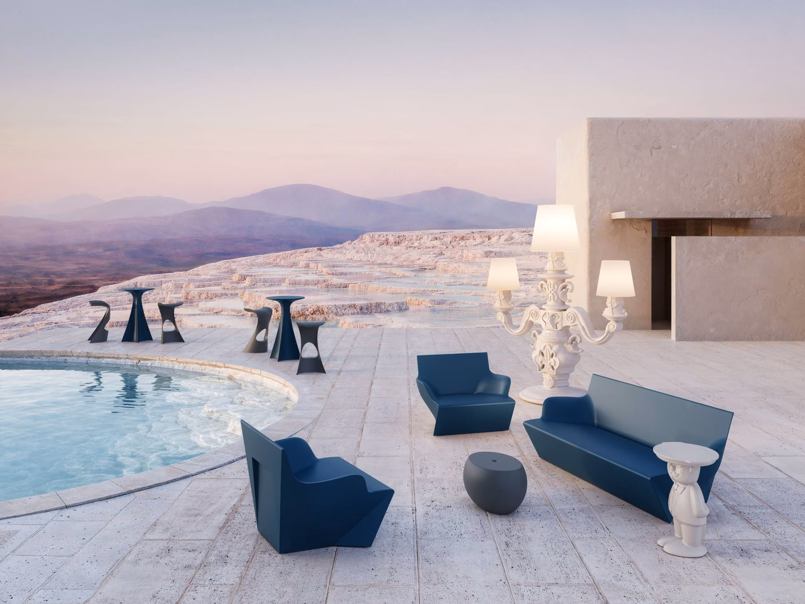 Slide: A Blos low table accompanies blue outdoor seating beside the pool.