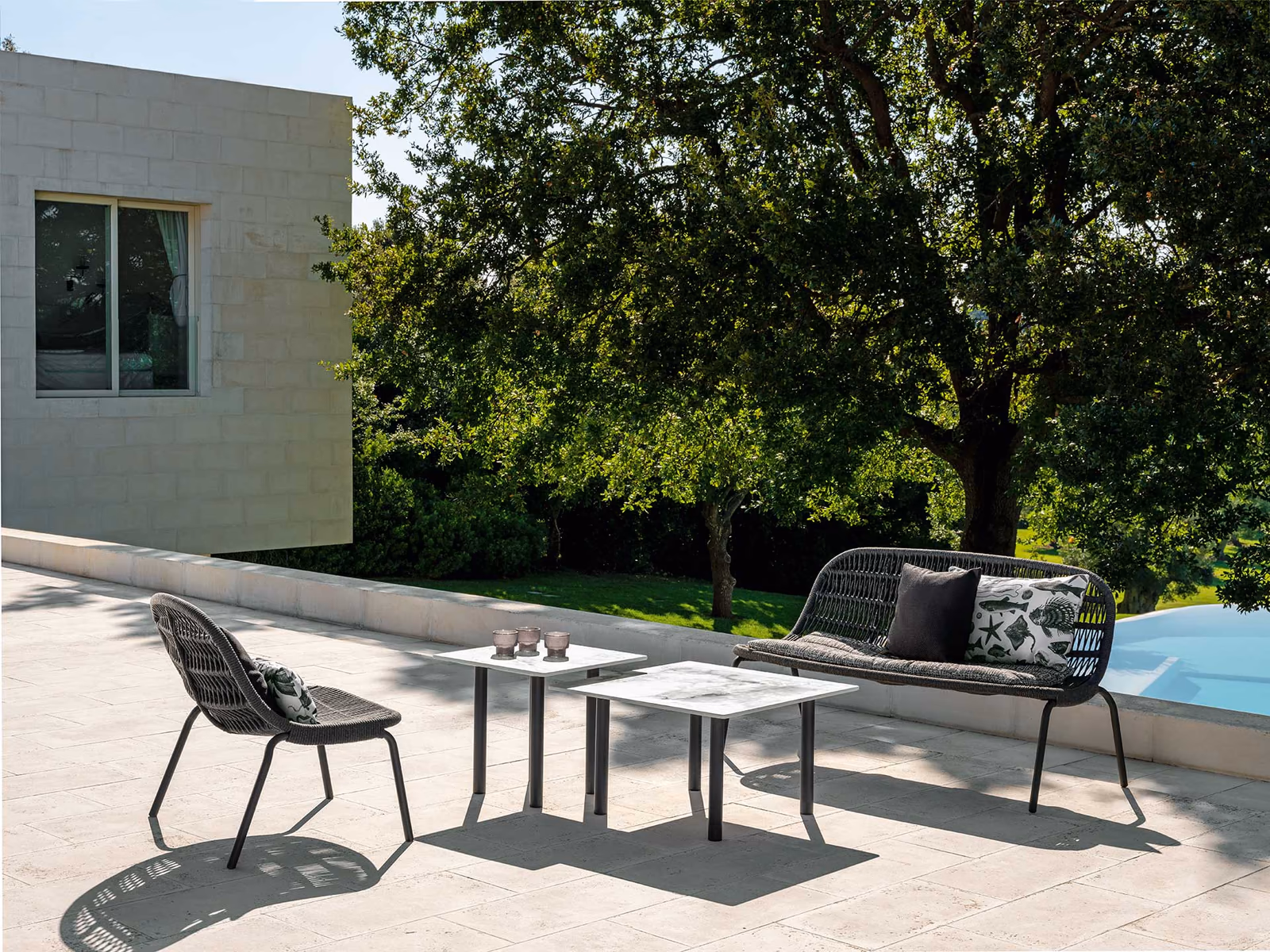 Talenti: A Panama Love Seat sofa provides a compact outdoor lounge setting.