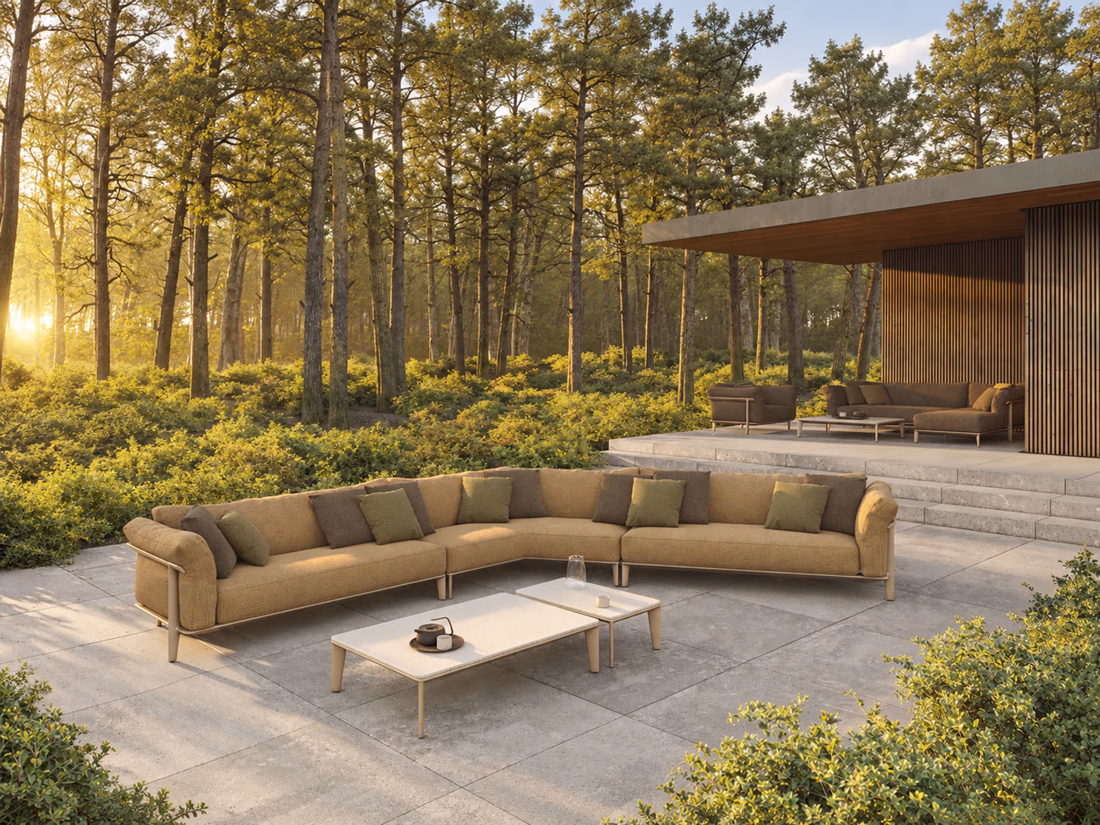 Vondom: An ochre Pasadena sectional creates a generous outdoor seating arrangement against a woodland backdrop.