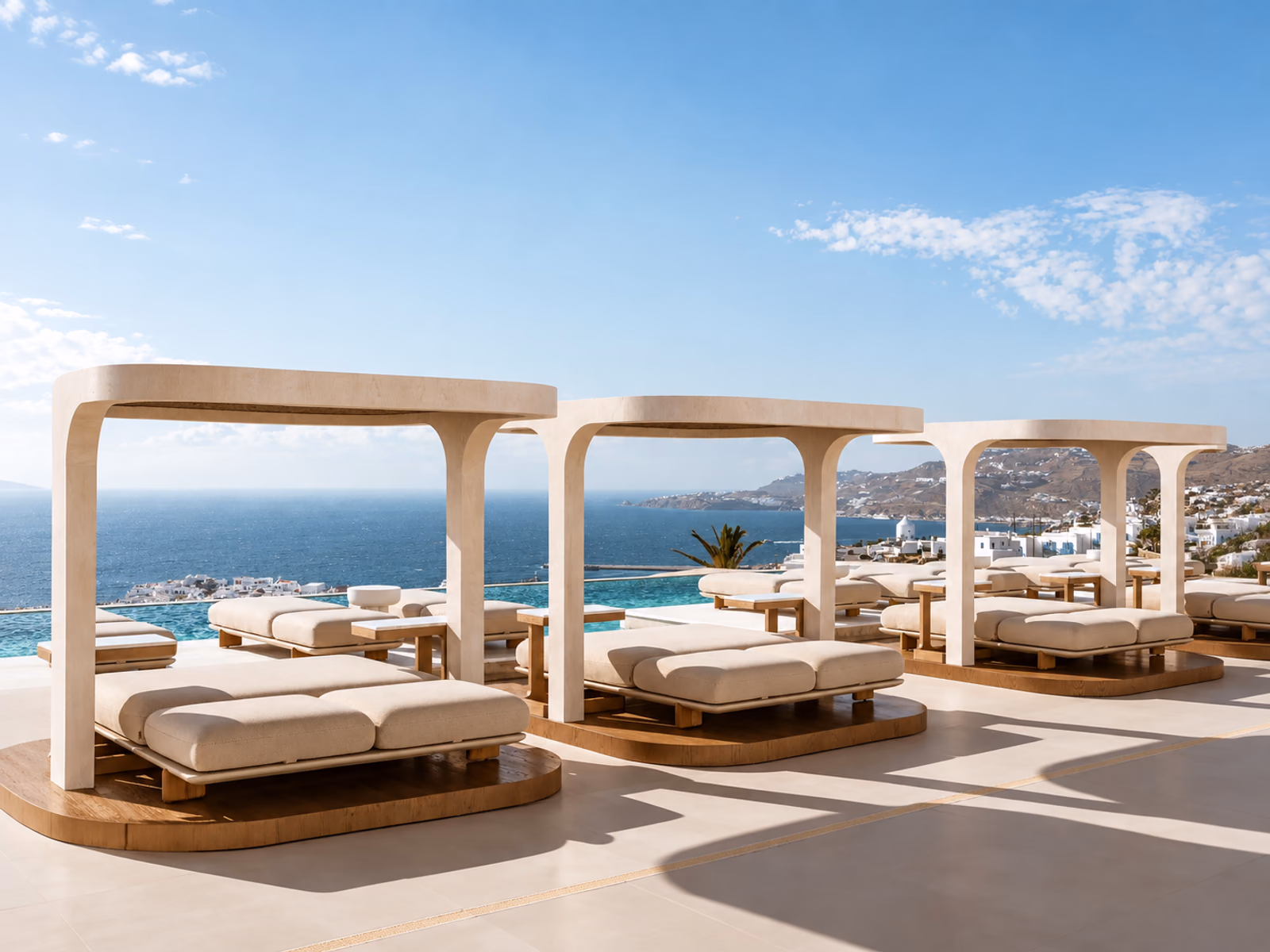 Vondom: Pale canopy daybeds furnish a terrace overlooking the sea.